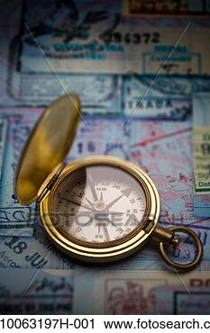 Stock Photography - antique brass 
compass on collage 
of passport stamps. 
fotosearch - search 
stock photos, 
pictures, images, 
and photo clipart