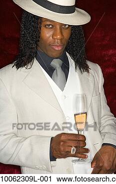 Stock Photography - man wearing hat 
holding champagne, 
portrait. fotosearch 
- search stock 
photos, pictures, 
images, and photo 
clipart