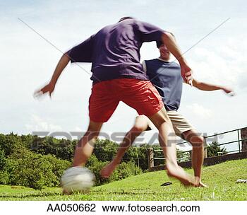 Stock Photo - two men playing 
soccer. fotosearch 
- search stock 
photos, pictures, 
images, and photo 
clipart