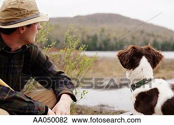 Stock Photo - young man with 
english setter 
looking at view. 
fotosearch - search 
stock photos, 
pictures, images, 
and photo clipart