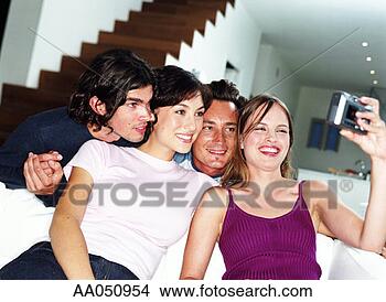 Stock Photo - group of friends 
taking self portrait, 
while sitting 
on sofa. fotosearch 
- search stock 
photos, pictures, 
images, and photo 
clipart