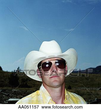 Picture - man in cowboy 
hat and sunglasses, 
lake roosevelt, 
washington, usa. 
fotosearch - search 
stock photos, 
pictures, images, 
and photo clipart