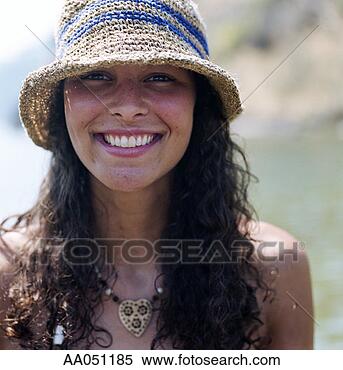 Stock Image - portrat of smiling 
young woman wearing 
straw hat. fotosearch 
- search stock 
photos, pictures, 
images, and photo 
clipart