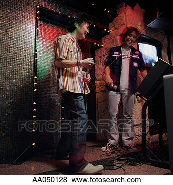 Stock Photo - two men on stage 
at a karaoke bar. 
fotosearch - search 
stock photos, 
pictures, images, 
and photo clipart