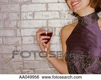 Stock Photo - young woman holding 
a glass of wine. 
fotosearch - search 
stock photos, 
pictures, images, 
and photo clipart