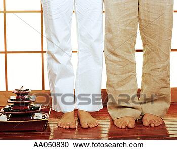 Stock Photography - barefoot couple 
standing on wood 
floor. fotosearch 
- search stock 
photos, pictures, 
images, and photo 
clipart