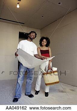 Stock Photo - couple looking 
over blueprints. 
fotosearch - search 
stock photos, 
pictures, images, 
and photo clipart