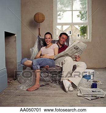 Stock Photography - couple relaxing 
in new home. fotosearch 
- search stock 
photos, pictures, 
images, and photo 
clipart