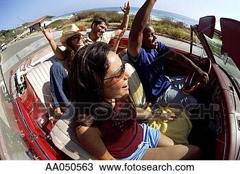 Stock Photo - friends riding 
in convertible 
near ocean. fotosearch 
- search stock 
photos, pictures, 
images, and photo 
clipart