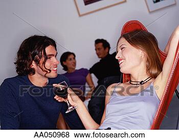 Stock Photo - friends at social 
gathering, drinking 
red wine. fotosearch 
- search stock 
photos, pictures, 
images, and photo 
clipart
