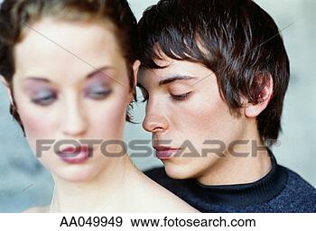 Stock Photograph - young man standing 
behind young woman. 
fotosearch - search 
stock photos, 
pictures, images, 
and photo clipart