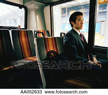 Stock Photo - businessman sitting 
on bus next to 
briefcase. fotosearch 
- search stock 
photos, pictures, 
images, and photo 
clipart