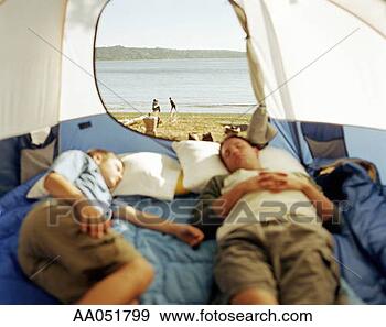 Stock Photograph - father and son 
sleeping in tent, 
mother taking 
picture of son 
on beach. fotosearch 
- search stock 
photos, pictures, 
images, and photo 
clipart