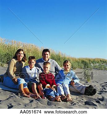 Stock Photo - man and woman 
sitting on sandy 
beach with three 
children (7-11). 
fotosearch - search 
stock photos, 
pictures, images, 
and photo clipart
