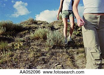 Stock Photo - two women hiking 
on trail, low 
section, drumheller, 
canada. fotosearch 
- search stock 
photos, pictures, 
images, and photo 
clipart