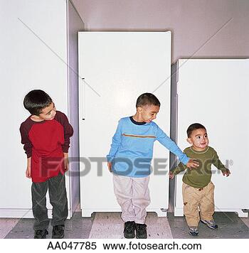 Stock Image - brothers stand 
next to refrigerators 
in appliance store. 
fotosearch - search 
stock photos, 
pictures, images, 
and photo clipart