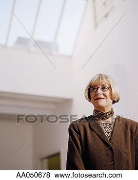 Stock Photo - businesswoman 
standing in office. 
fotosearch - search 
stock photos, 
pictures, images, 
and photo clipart