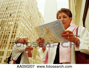 Picture - couple looking 
at a map. fotosearch 
- search stock 
photos, pictures, 
images, and photo 
clipart