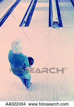 Stock Photo - elderly woman 
at a bowling alley. 
fotosearch - search 
stock photos, 
pictures, images, 
and photo clipart