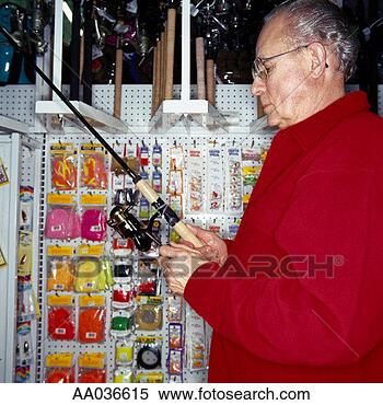 Stock Image - man shopping for 
fishing poles. 
fotosearch - search 
stock photos, 
pictures, images, 
and photo clipart