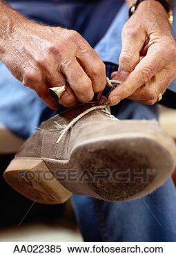 Stock Image - man tying his 
bowling shoes. 
fotosearch - search 
stock photos, 
pictures, images, 
and photo clipart