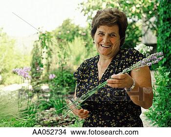 Stock Photo - mature woman gardening 
(selective focus). 
fotosearch - search 
stock photos, 
pictures, images, 
and photo clipart