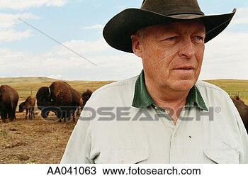 Stock Photo - mature cowboy 
on the range. 
fotosearch - search 
stock photos, 
pictures, images, 
and photo clipart