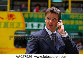 Stock Photo - businessman in 
street on mobile 
phone, hong kong. 
fotosearch - search 
stock photos, 
pictures, images, 
and photo clipart
