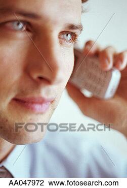 Stock Photo - man talking on 
cell phone, close-up 
(focus on man's 
eye). fotosearch 
- search stock 
photos, pictures, 
images, and photo 
clipart