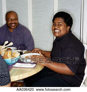 Stock Photography - father and son 
at dinner table. 
fotosearch - search 
stock photos, 
pictures, images, 
and photo clipart