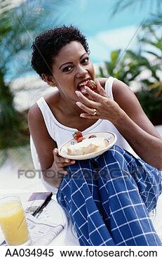 Stock Image - woman eating a 
strawberry. fotosearch 
- search stock 
photos, pictures, 
images, and photo 
clipart