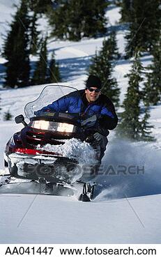 Picture - man riding snowmobile, 
winter. fotosearch 
- search stock 
photos, pictures, 
images, and photo 
clipart
