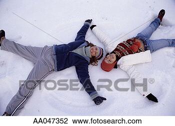 Stock Photo - teenage girls 
(14 to 17) make 
snow angels, elevated 
view. fotosearch 
- search stock 
photos, pictures, 
images, and photo 
clipart