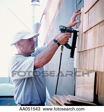 Stock Photo - man installing 
cedar shingles. 
fotosearch - search 
stock photos, 
pictures, images, 
and photo clipart