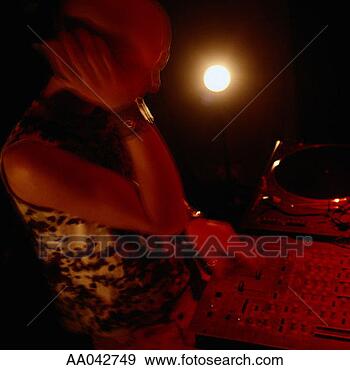 Stock Photograph - dj spinning records 
at niggtclub. 
fotosearch - search 
stock photos, 
pictures, images, 
and photo clipart