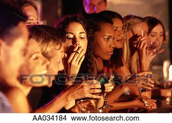 Stock Photo - young people drinking 
at a bar. fotosearch 
- search stock 
photos, pictures, 
images, and photo 
clipart