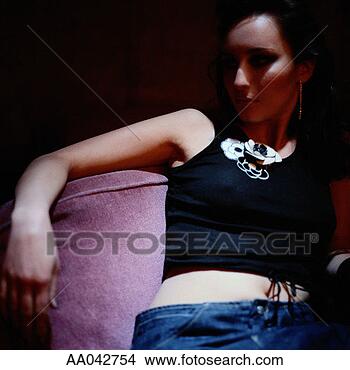 Stock Photo - young woman lounging 
on nightclub sofa. 
fotosearch - search 
stock photos, 
pictures, images, 
and photo clipart