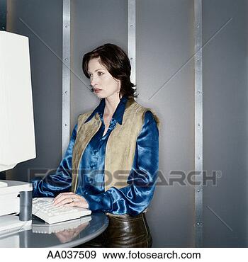 Stock Photograph - woman using computer 
in modern office 
interior. fotosearch 
- search stock 
photos, pictures, 
images, and photo 
clipart