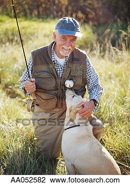 Stock Photo - elderly man with 
fishing gear, 
petting golden 
labrador. fotosearch 
- search stock 
photos, pictures, 
images, and photo 
clipart