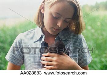 Stock Photo - girl holding a 
kitten. fotosearch 
- search stock 
photos, pictures, 
images, and photo 
clipart