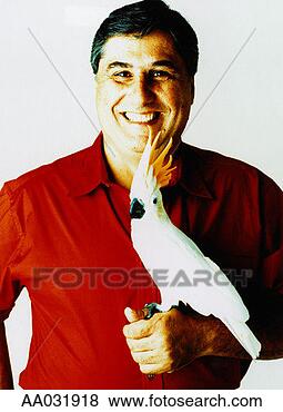 Stock Photo - portrait of man 
with pet cockatoo. 
fotosearch - search 
stock photos, 
pictures, images, 
and photo clipart