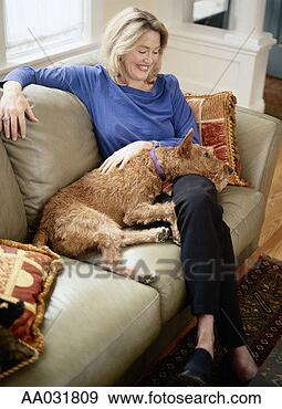 Stock Photograph - woman with irish 
terrier on lap. 
fotosearch - search 
stock photos, 
pictures, images, 
and photo clipart