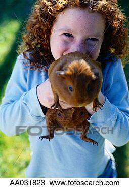 Stock Photo - young girl and 
guinea pig. fotosearch 
- search stock 
photos, pictures, 
images, and photo 
clipart
