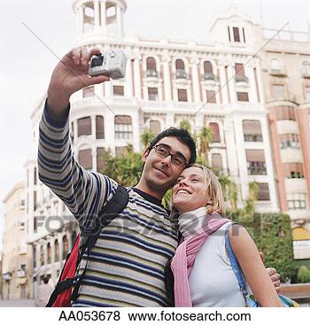 Stock Photo - couple taking 
self-portrait 
in front of sights 
in spain, high 
section. fotosearch 
- search stock 
photos, pictures, 
images, and photo 
clipart