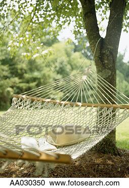 Stock Photography - hammock, book, 
hat, and glasses. 
fotosearch - search 
stock photos, 
pictures, images, 
and photo clipart