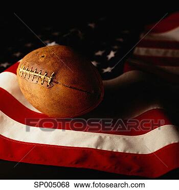 Stock Photo - football on american 
flag. fotosearch 
- search stock 
photos, pictures, 
images, and photo 
clipart