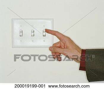 Stock Photography - man flipping light 
switch, close-up 
of hand. fotosearch 
- search stock 
photos, pictures, 
images, and photo 
clipart