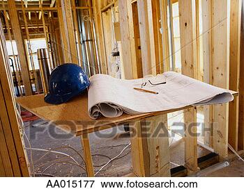 Picture - blueprint and 
a hard hat inside 
a building frame. 
fotosearch - search 
stock photos, 
pictures, images, 
and photo clipart