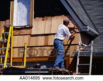 Stock Image - man hammering 
wood siding on 
a house. fotosearch 
- search stock 
photos, pictures, 
images, and photo 
clipart