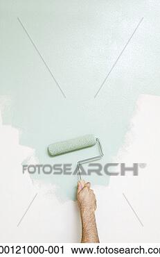 Stock Photography - man rolling paint 
onto wall, close-up 
of hand and roller. 
fotosearch - search 
stock photos, 
pictures, images, 
and photo clipart